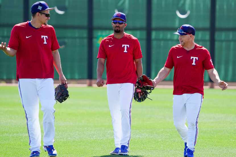 From left, Texas Rangers infielder Corey Seager, infielder Marcus Semien and outfielder Kole...