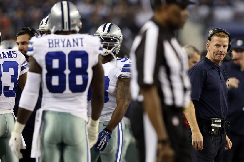 Dallas Cowboys head coach Jason Garrett glances at Dallas Cowboys wide receiver Dez Bryant...