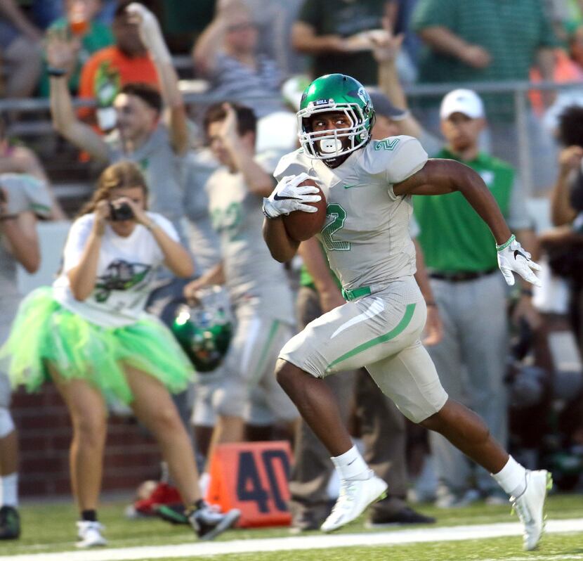 It was "off to the races" for Waxahachie running back Kenedy Snell (2) as he scampers down...