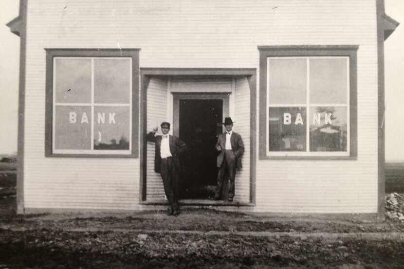 On Jan. 25, 1912 W.E. McLaughlin (right) opened the doors to his bank in the new town of...