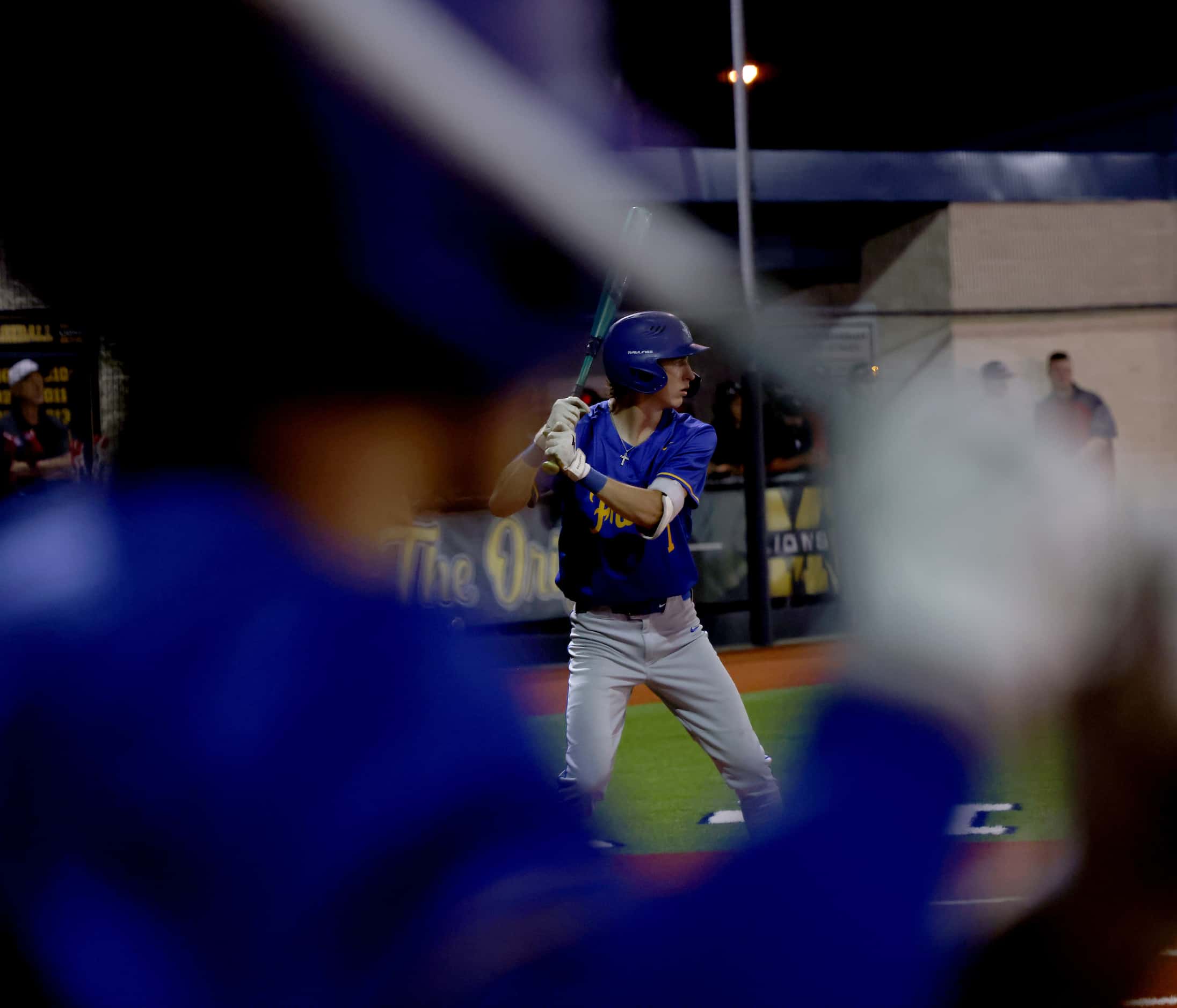 Frisco's Landon Karrh (7) bats during the top of the 7th inning as a teammate waits his turn...