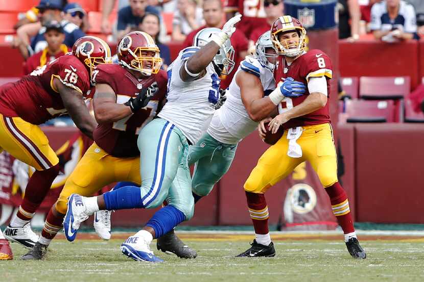 Dallas Cowboys defensive tackle Tyrone Crawford (98) sacks Washington Redskins quarterback...