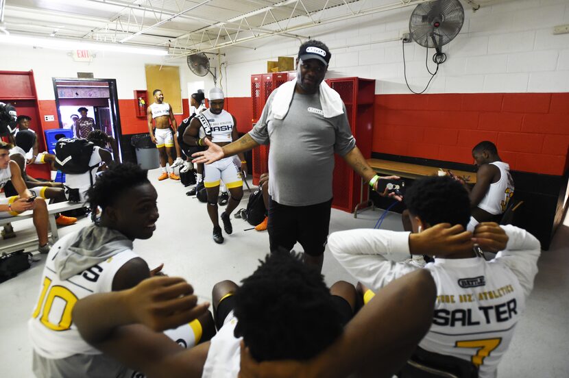 True Buzz coach Carlos Word talks to his players in the locker room prior to the Pylon 7v7...