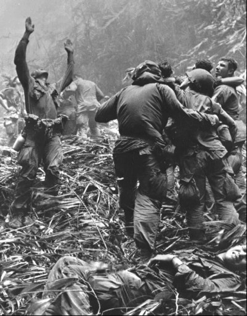 A paratrooper of A Co., 101st Airborne Division, guides a medical evacuation helicopter into...