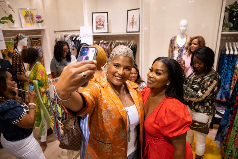 Christine Lynn, left takes a selfie with Tavia Whitlowe at the pop-up.