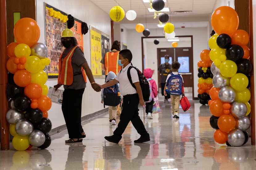 Students and teachers during the first day of school on Monday, Aug. 2, 2021, at H.I....