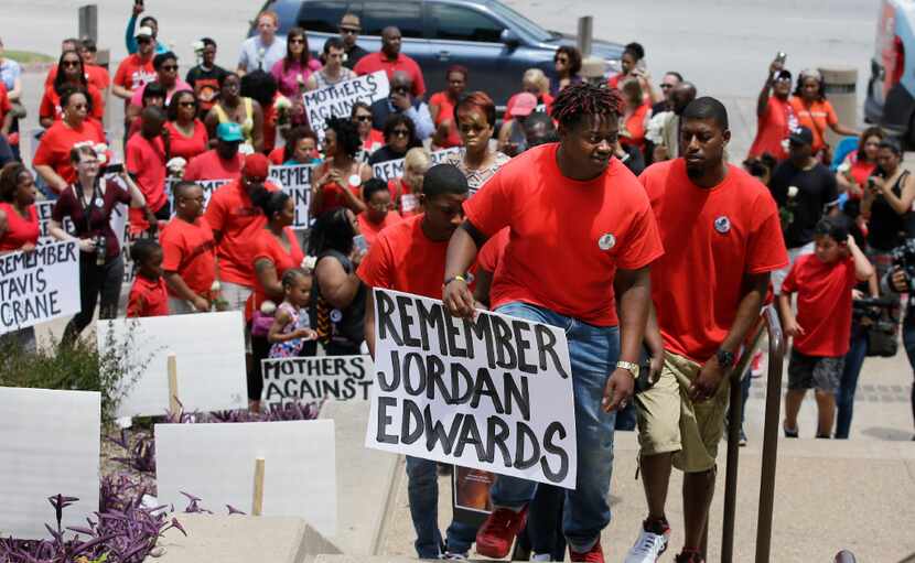 Slain teen Jordan Edwards' brother Vidal Allen (front) led his family up the courthouse...