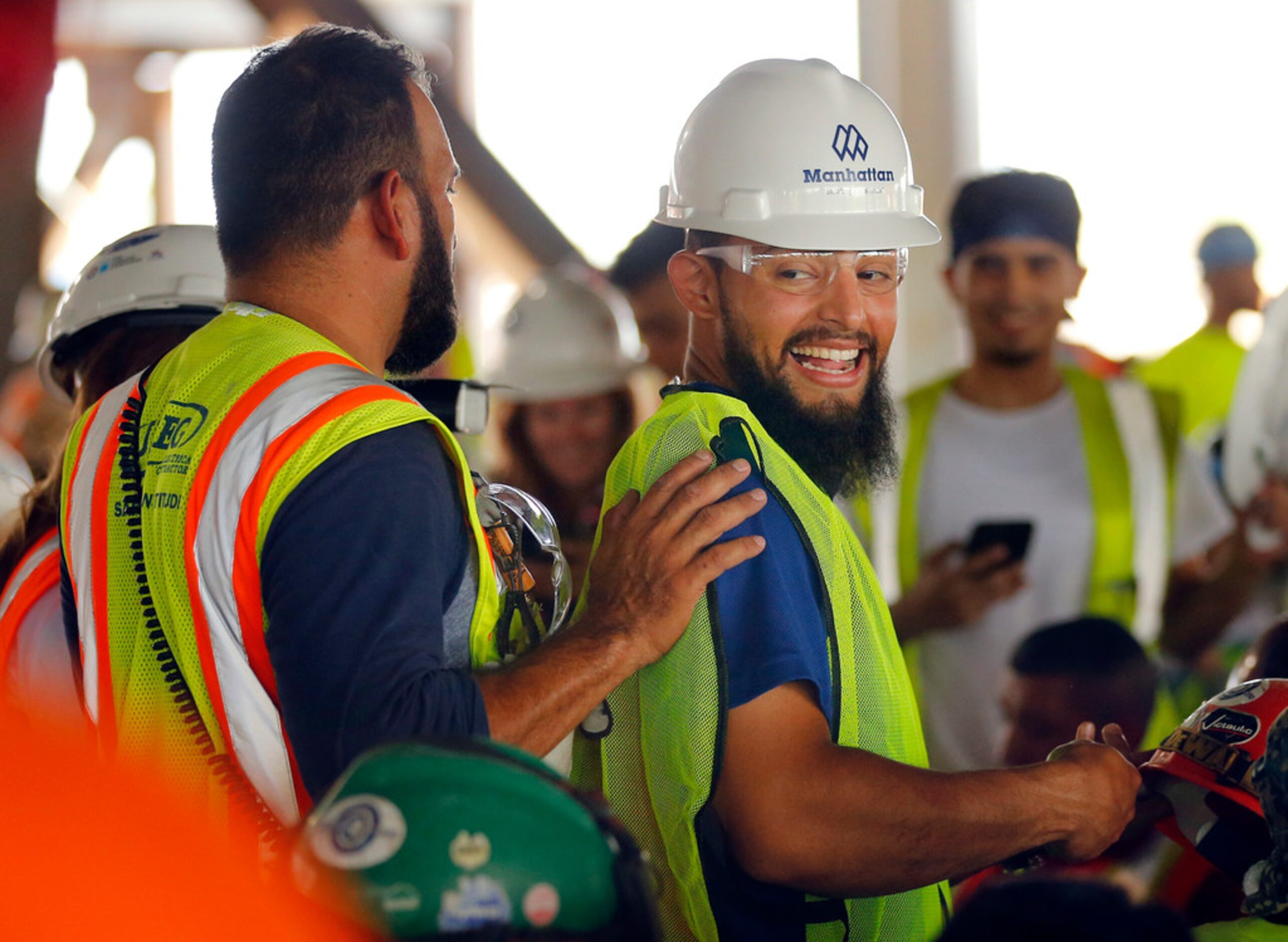 Texas Rangers second baseman Rougned Odor (right) joined hundreds of construction workers...