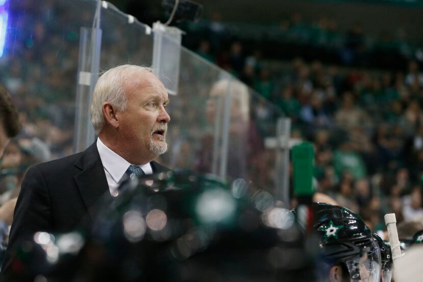 Dallas Stars coach Lindy Ruff watches as his played the Florida Panthers during the first...