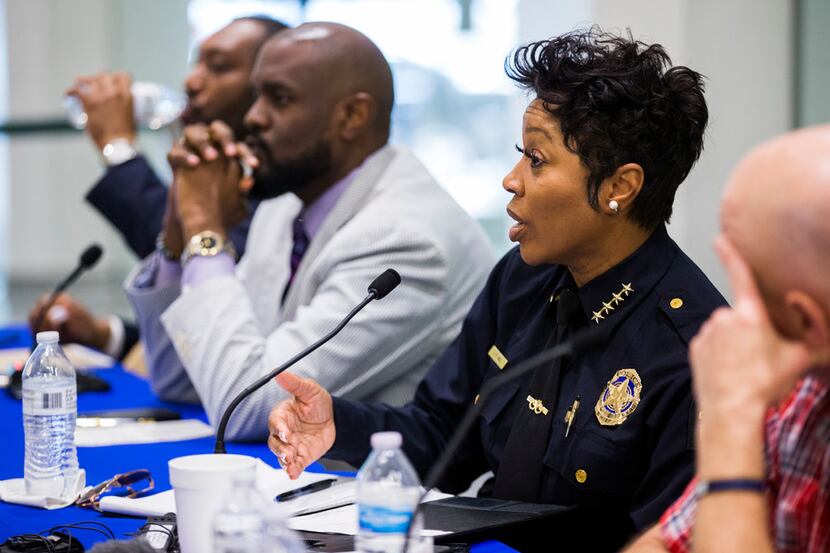 Dallas Police Chief Renee Hall answers a question at a public safety forum to address an...