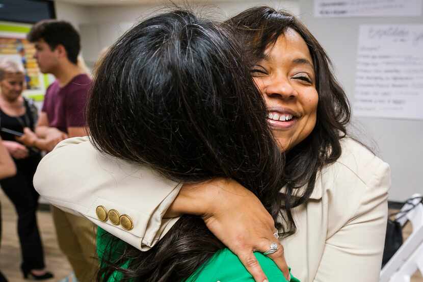 Lavinia Masters hugs Rep. Victoria Neave after Governor Greg Abbott signed House Bill 8...