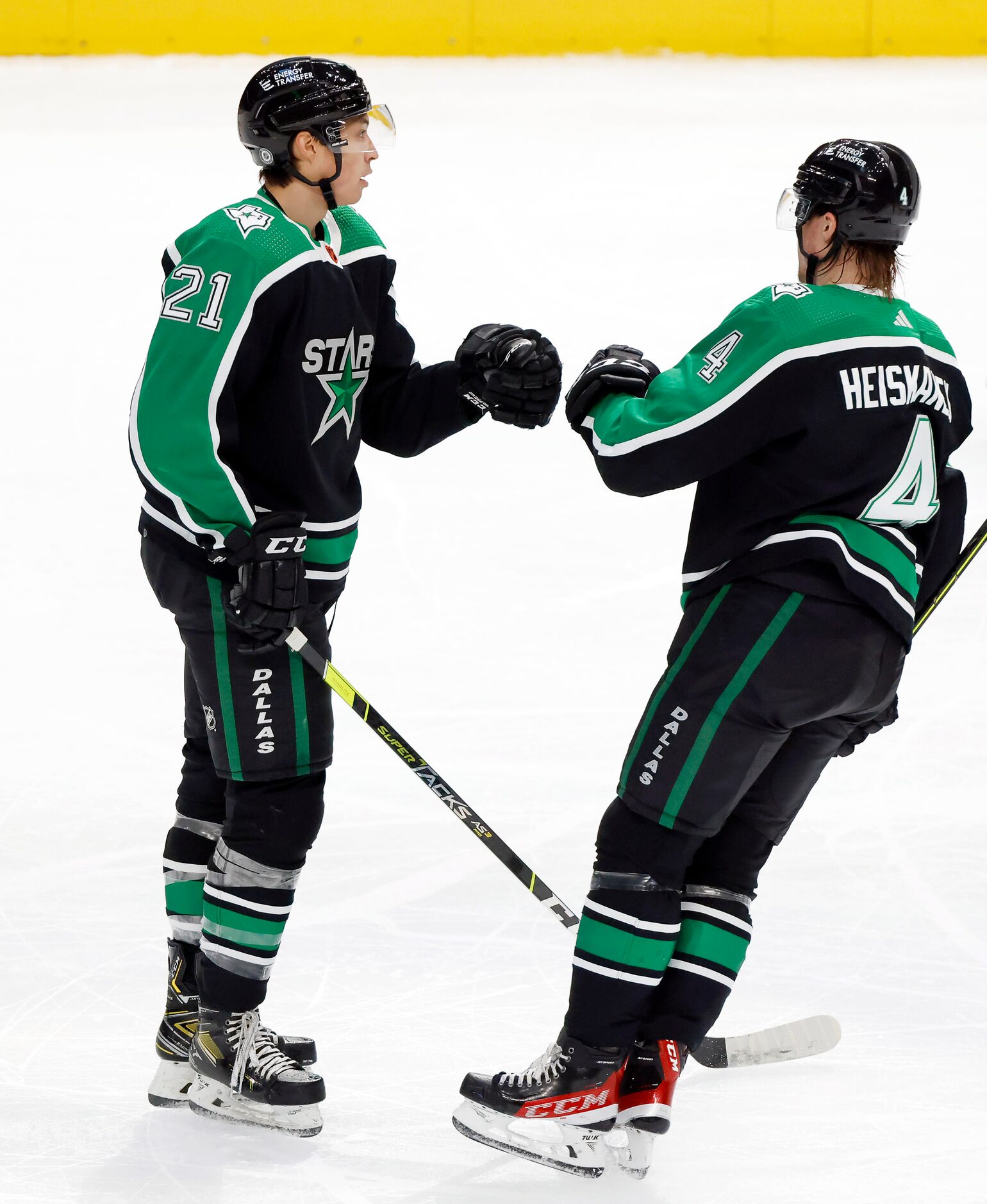 Dallas Stars defenseman Miro Heiskanen (4) congratulates left wing Jason Robertson (21) on...