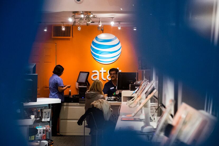 An AT&T employees' union is suing to stop layoffs of 713 workers.