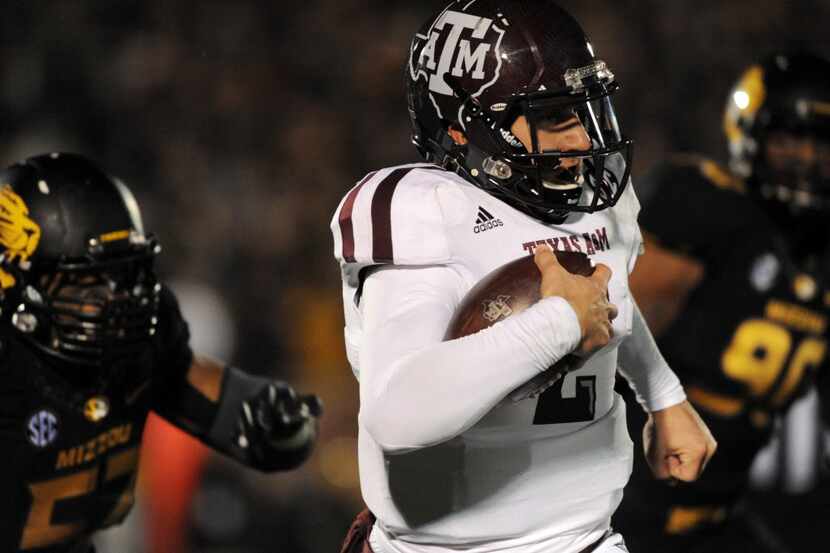 Texas A&M Aggies quarterback Johnny Manziel (2) runs the ball as Missouri Tigers defensive...