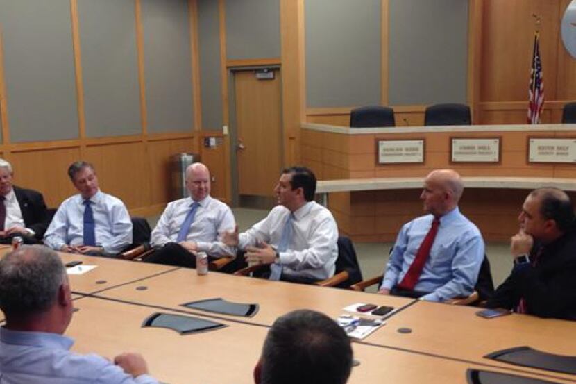 Collin County Commissioner Chris Hill (third from left) listened as Sen. Ted Cruz met with a...