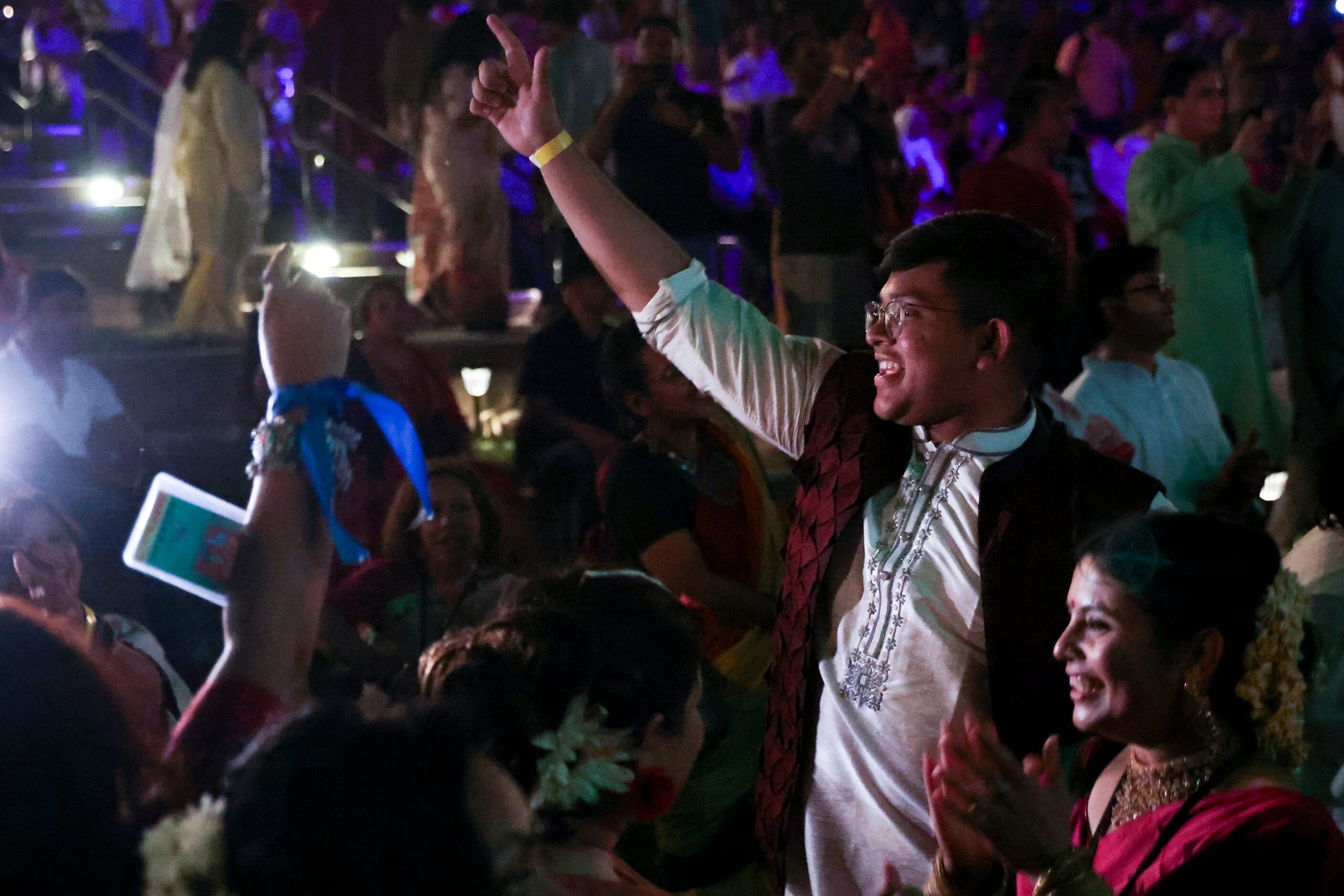 Waafi Awal (center) cheers alongside the crowd during the end of Boishakhi Mela hosted by...