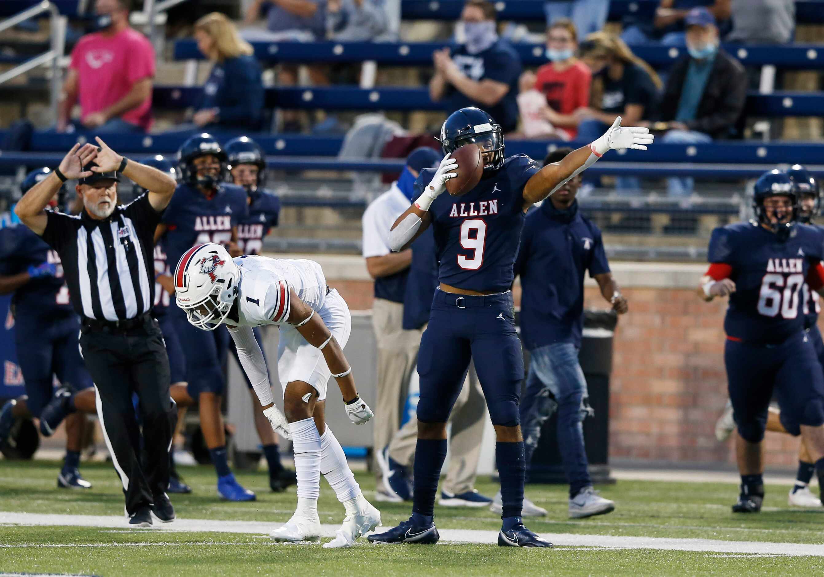 Allen's Bryson Green (9) signals the first down after making a catch in front of Humble...