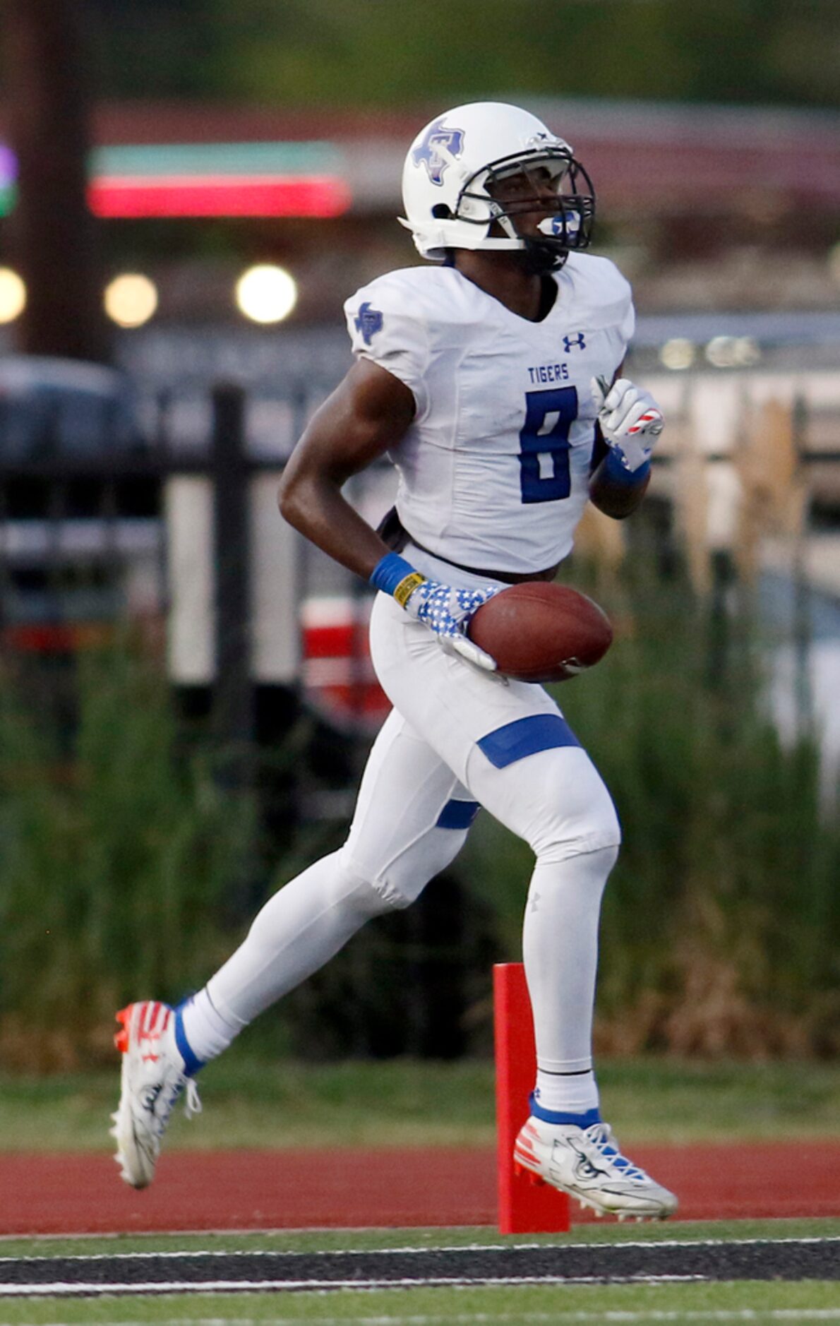 Trinity Christian-Cedar Hill receiver Marques Buford (8) strolls into the end zone for a...