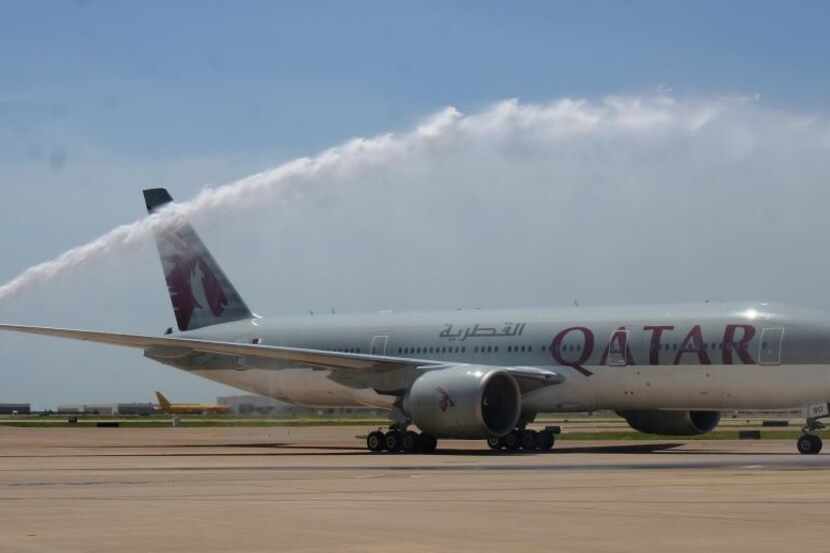  The first Qatar Airways flight is welcomed July 1, 2014, to Dallas/Fort Worth International...