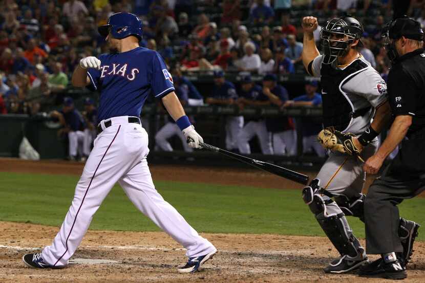 Texas Rangers left fielder Jeff Baker (15) strikes out to end the 8th inning of MLB...