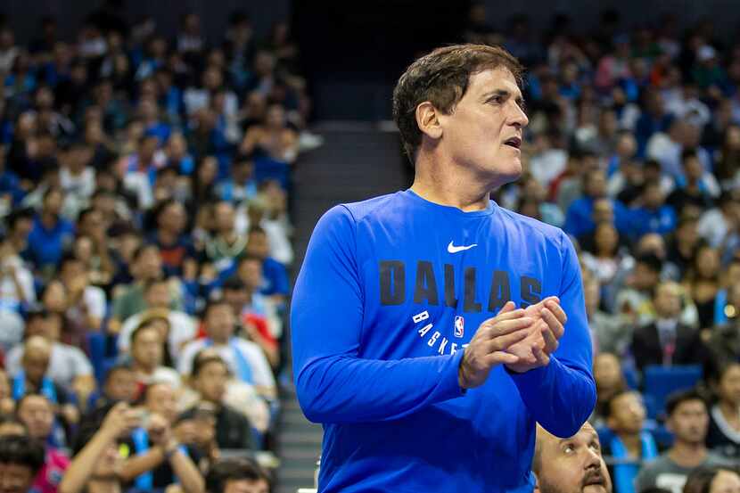 Dallas Mavericks owner Mark Cuban cheers his team during the first half of an NBA China...