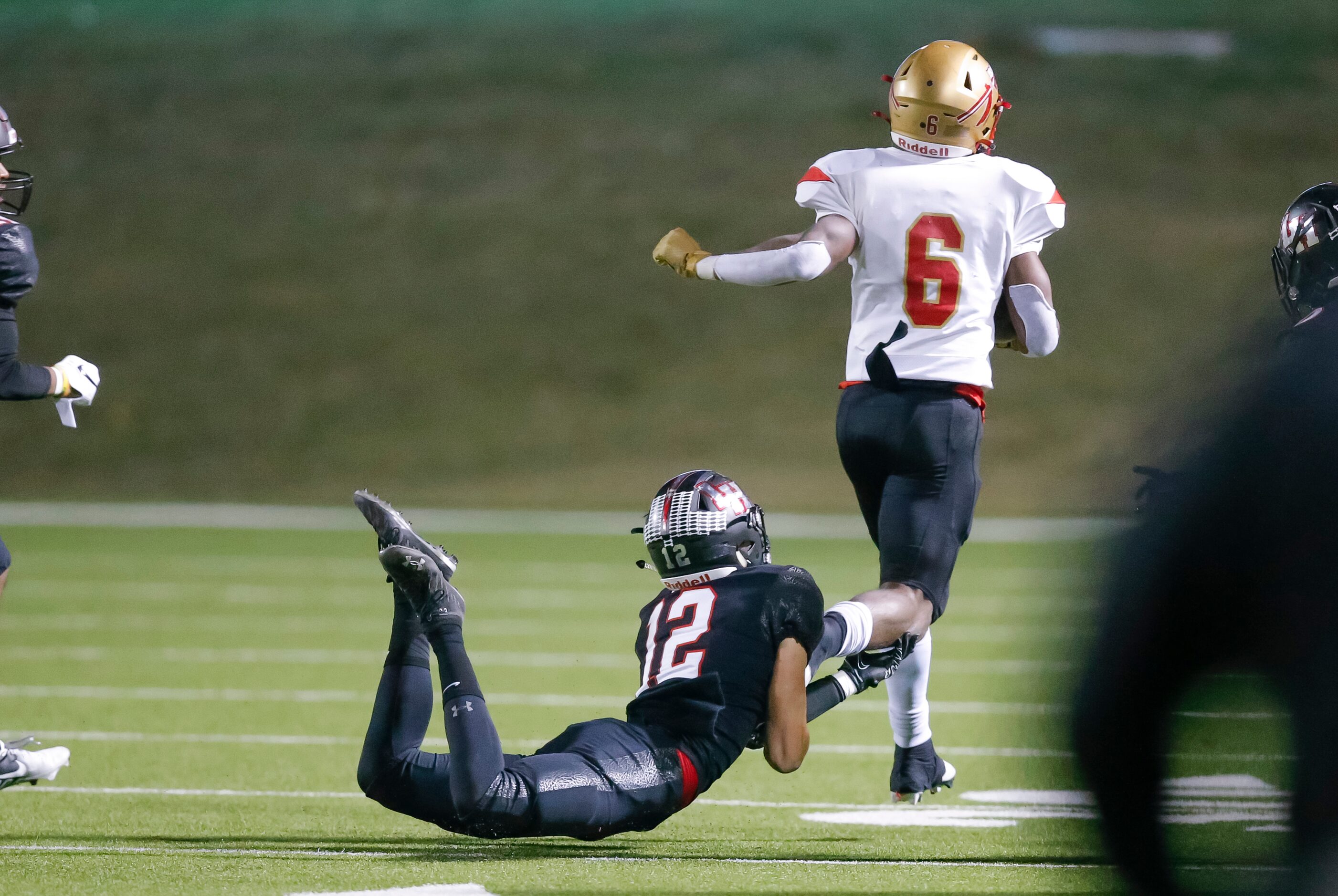 South Grand Prairie junior running back AJ Newberry (6) slips a tackle by Lake Highlands...