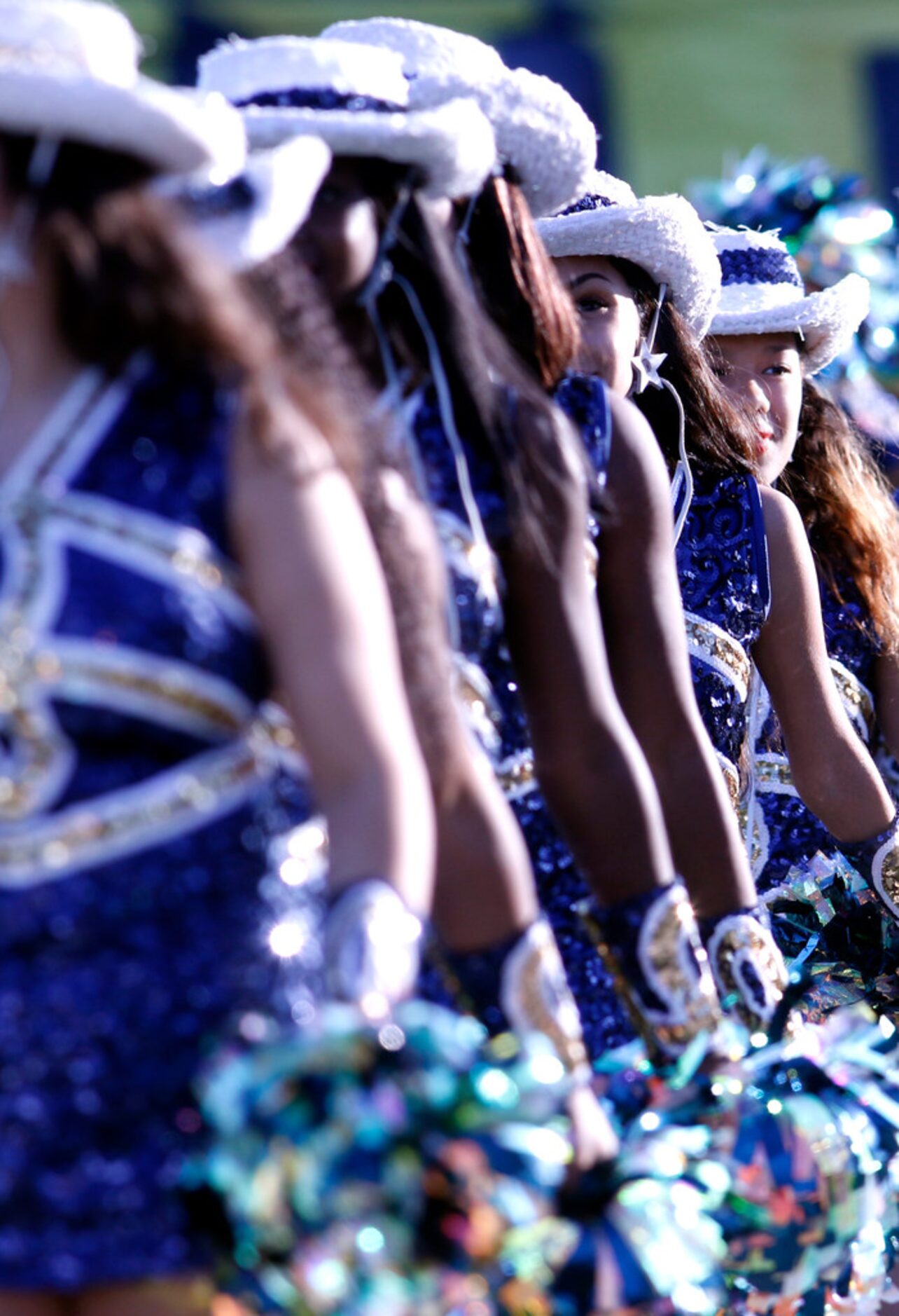 Members of the Arlington Lamar drill team await the arrival of the players onto the field...