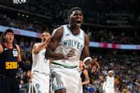 Minnesota Timberwolves guard Anthony Edwards reacts after his shot was blocked in the second...