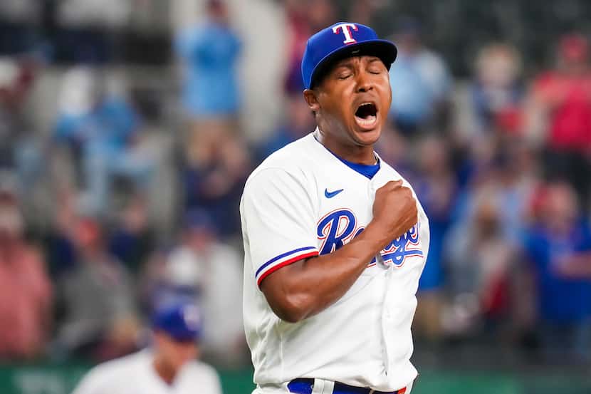 Texas Rangers relief pitcher Jose Leclerc reacts after striking out Philadelphia Phillies...