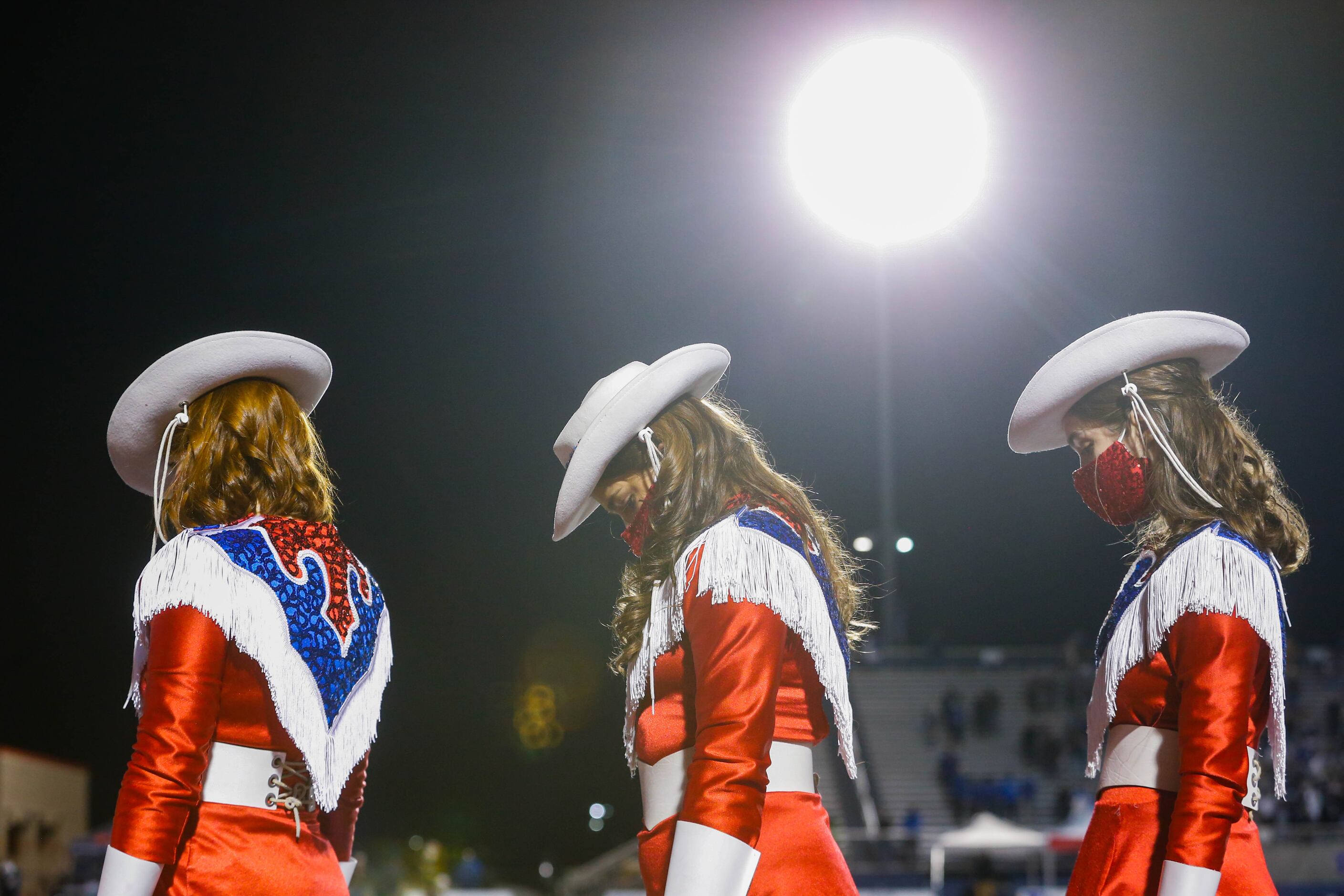 The Parish Rosette bow their heads during the invocation before the TAPPS Division I state...