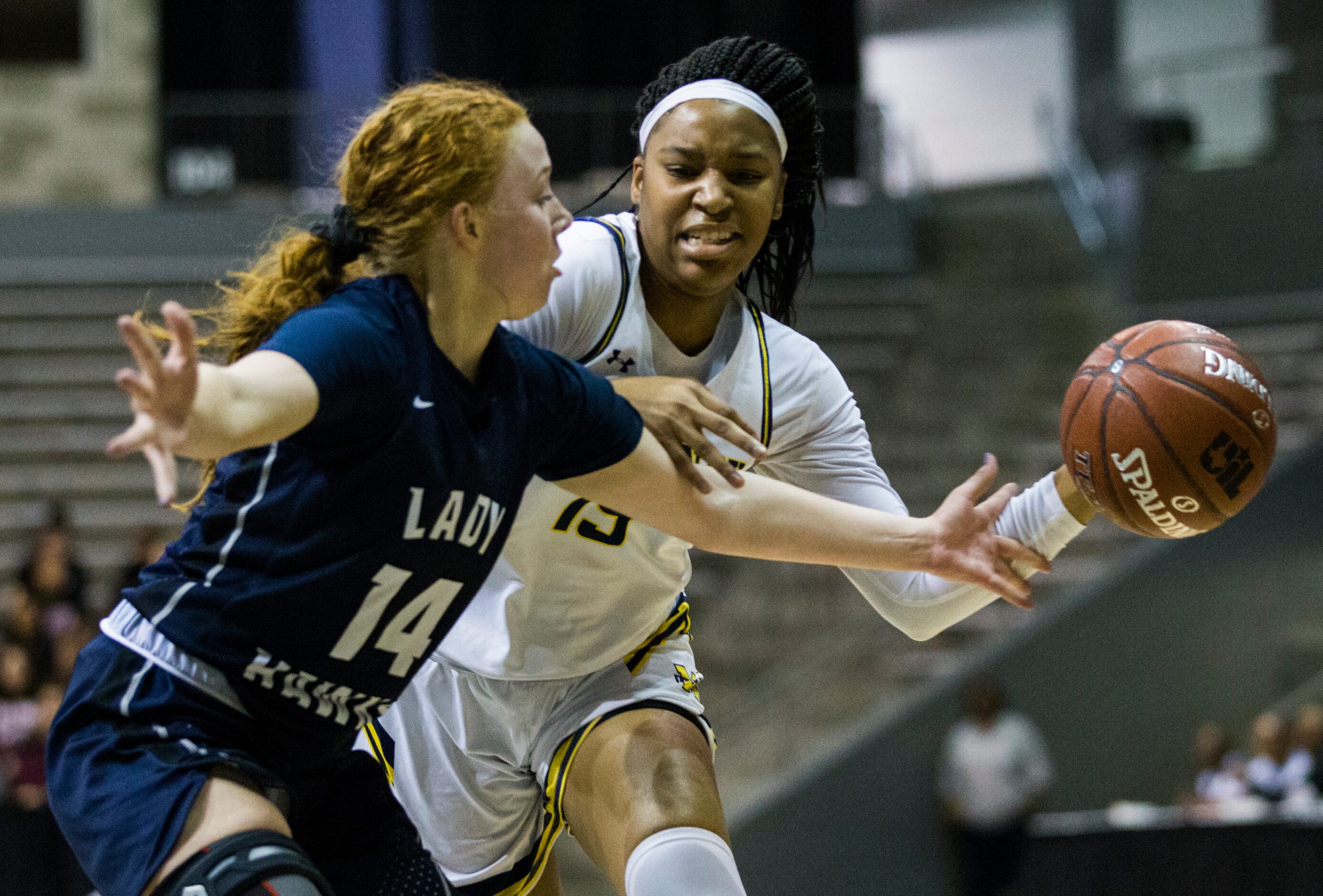 McKinney guard Taylor Jackson (15) and Pflugerville Hendrickson Sarah Malinowski (14) reach...