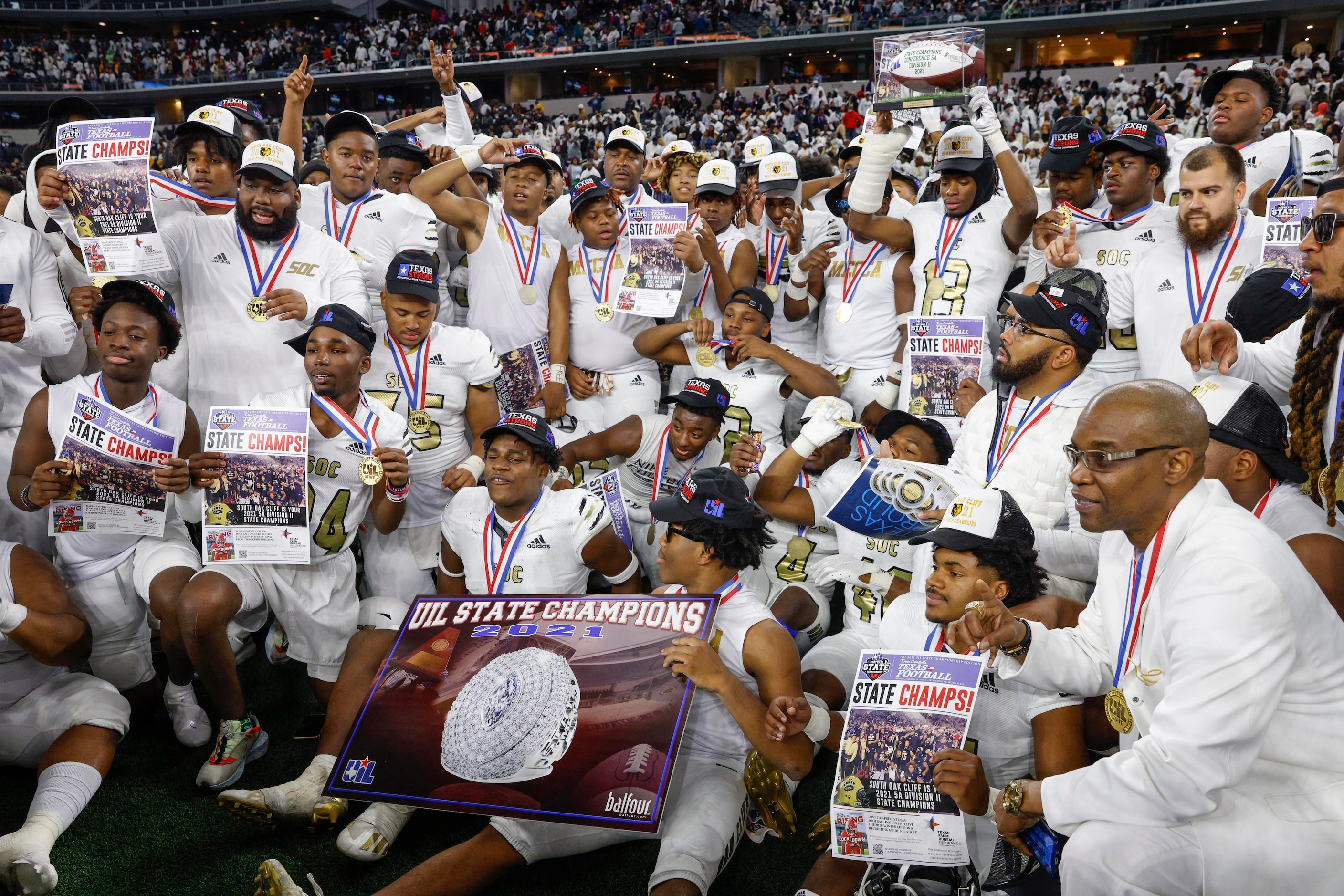 The South Oak Cliff team poses with their medals after winning the Class 5A Division II...