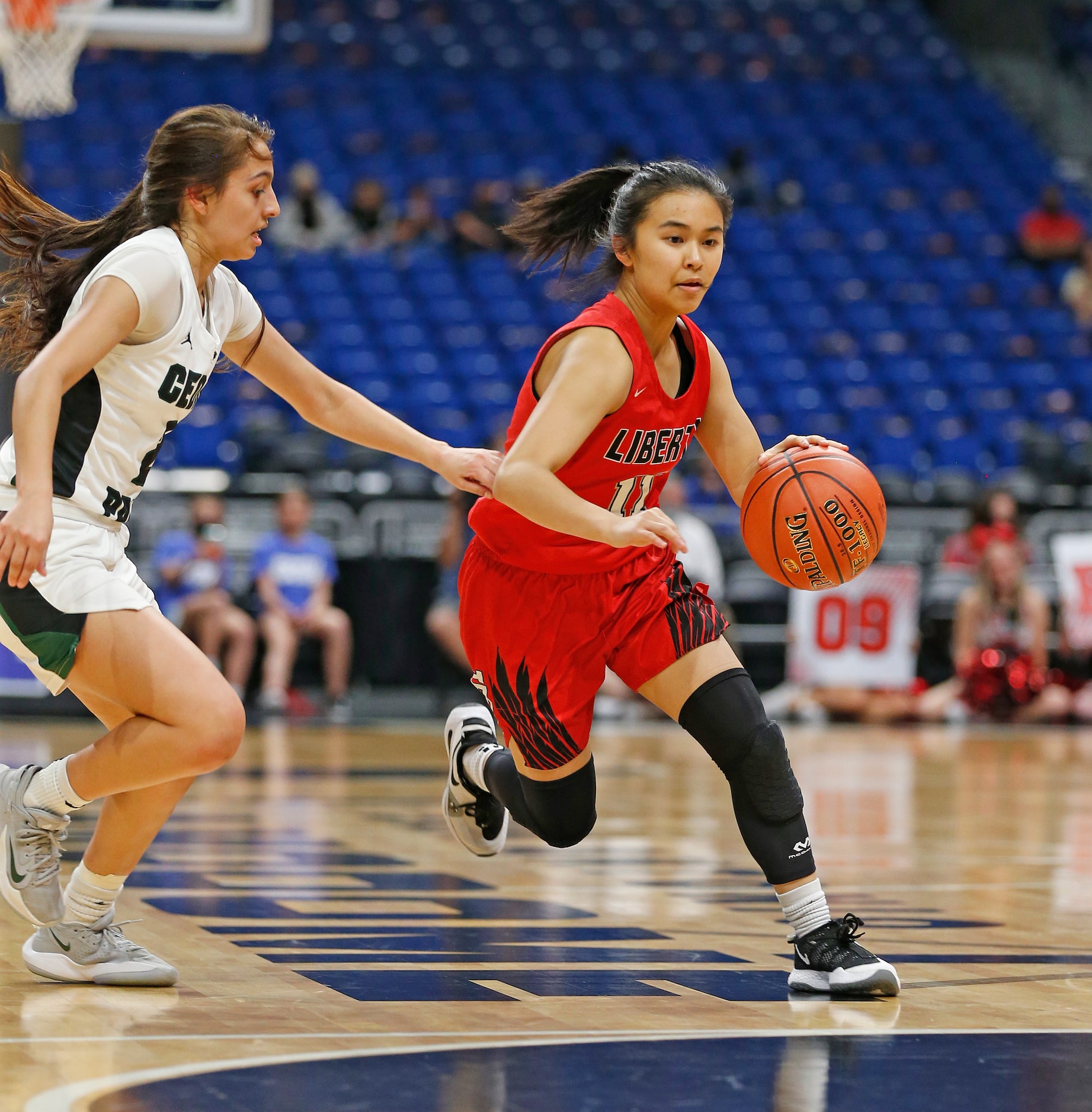 Frisco Liberty Kamen Wong #11 drives to the basket. Frisco Liberty vs. Cedar Park in girls...