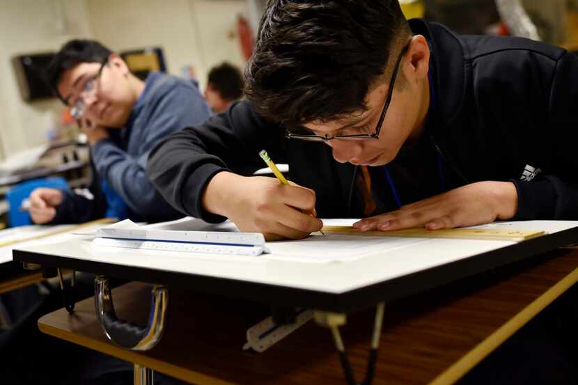José Barriga works on creating an elevation drawing of a structure during the class...