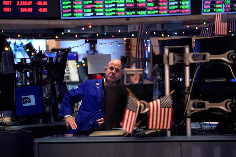A trader reacts on the floor of the New York Stock Exchange at the closing bell on Dec. 30...