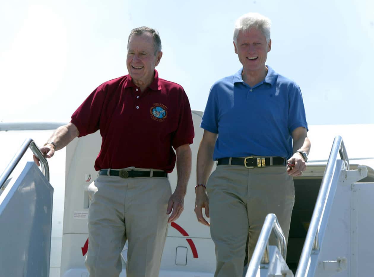 In this February 18, 2005, photo, former presidents George Bush and Bill Clinton arrive in...