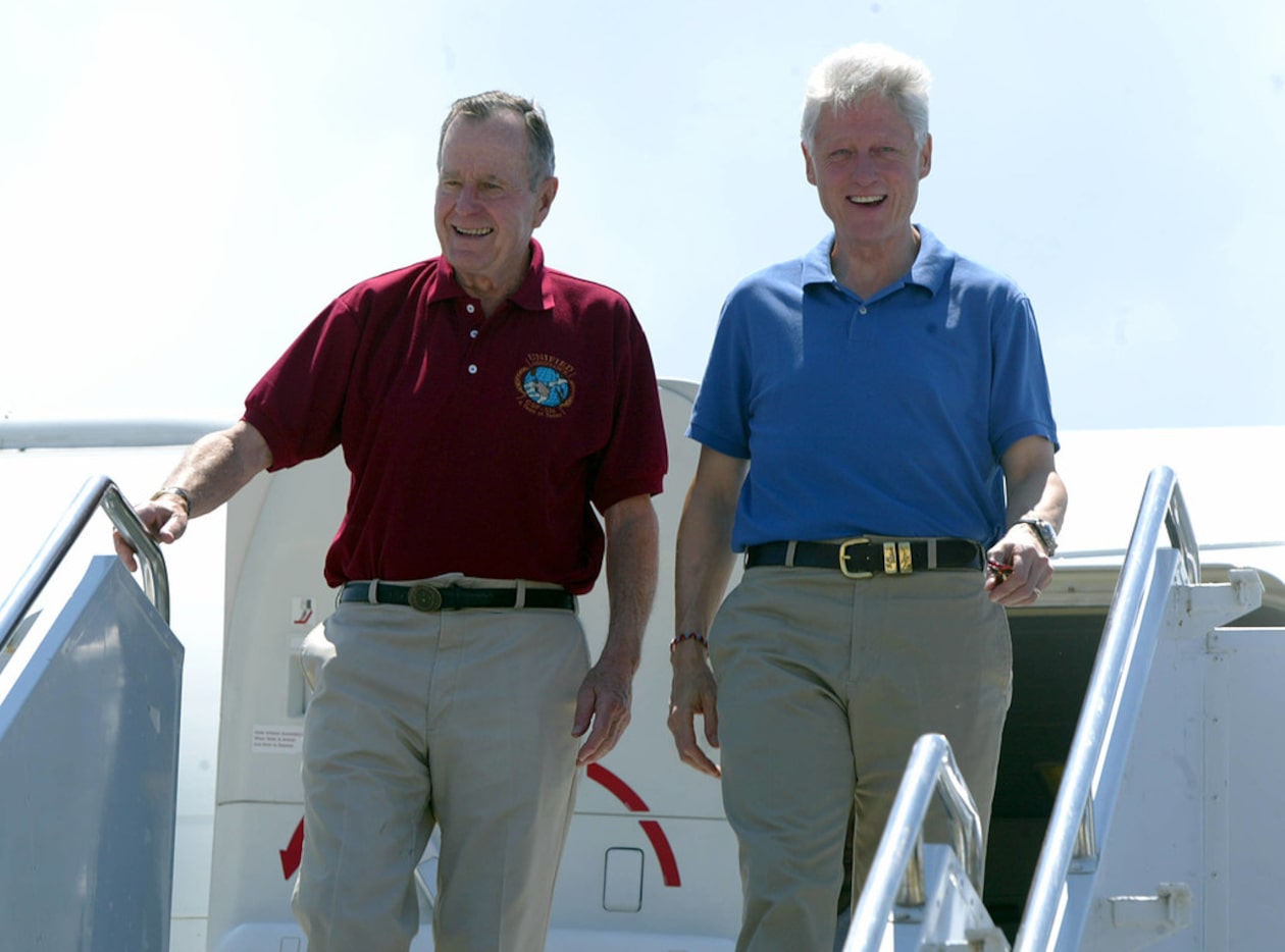 In this February 18, 2005, photo, former presidents George Bush and Bill Clinton arrive in...