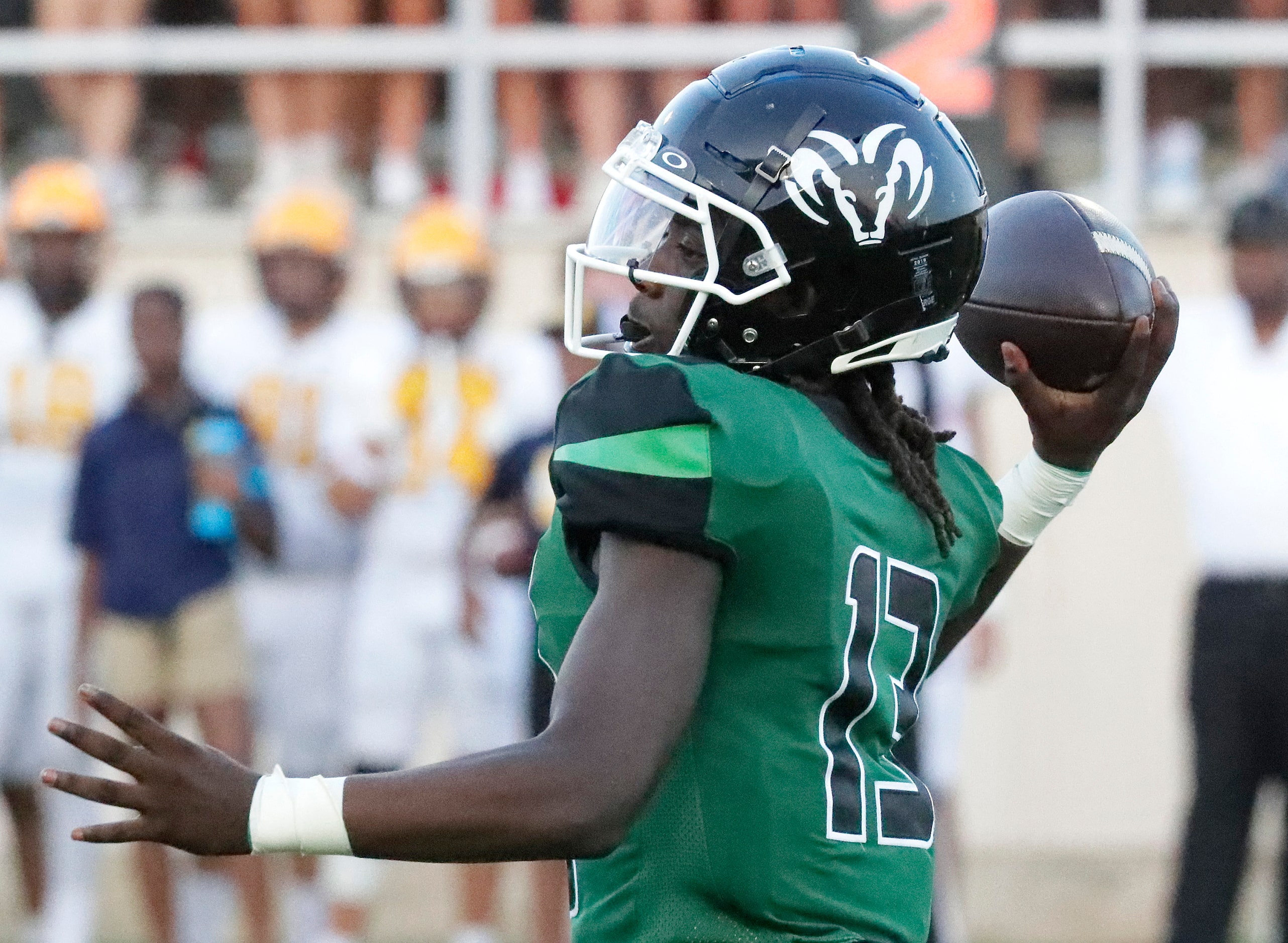 Berkner High School quarterback Demarcus Calhoun (13) throws a pass during the first half as...