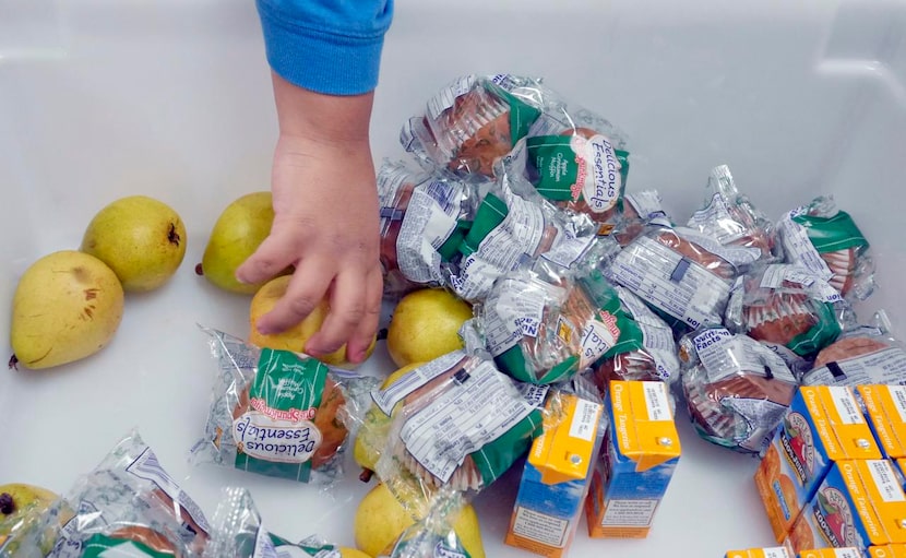 
A student assembles his Breakfast in the Classroom meal at Daugherty Elementary School in...