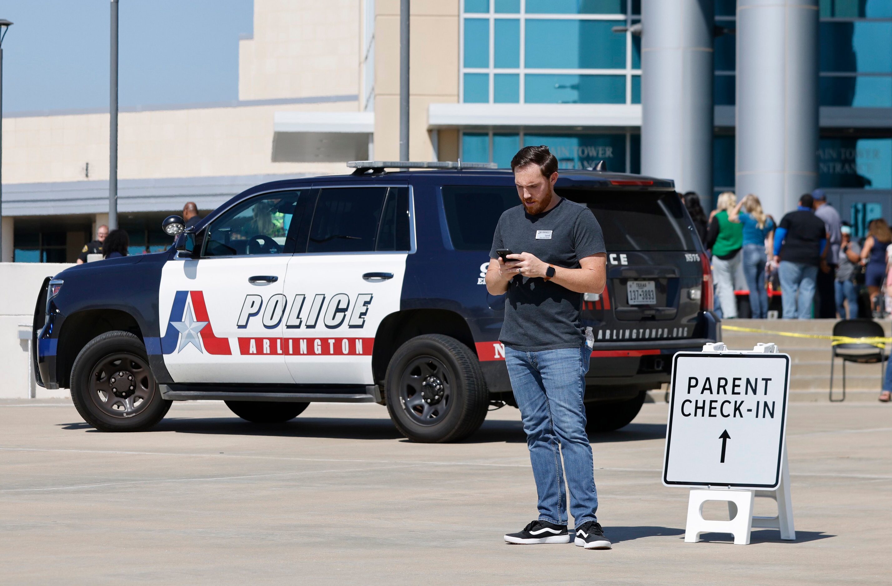 Parents of Timberview High School students wait outside of the Mansfield ISD Center for The...