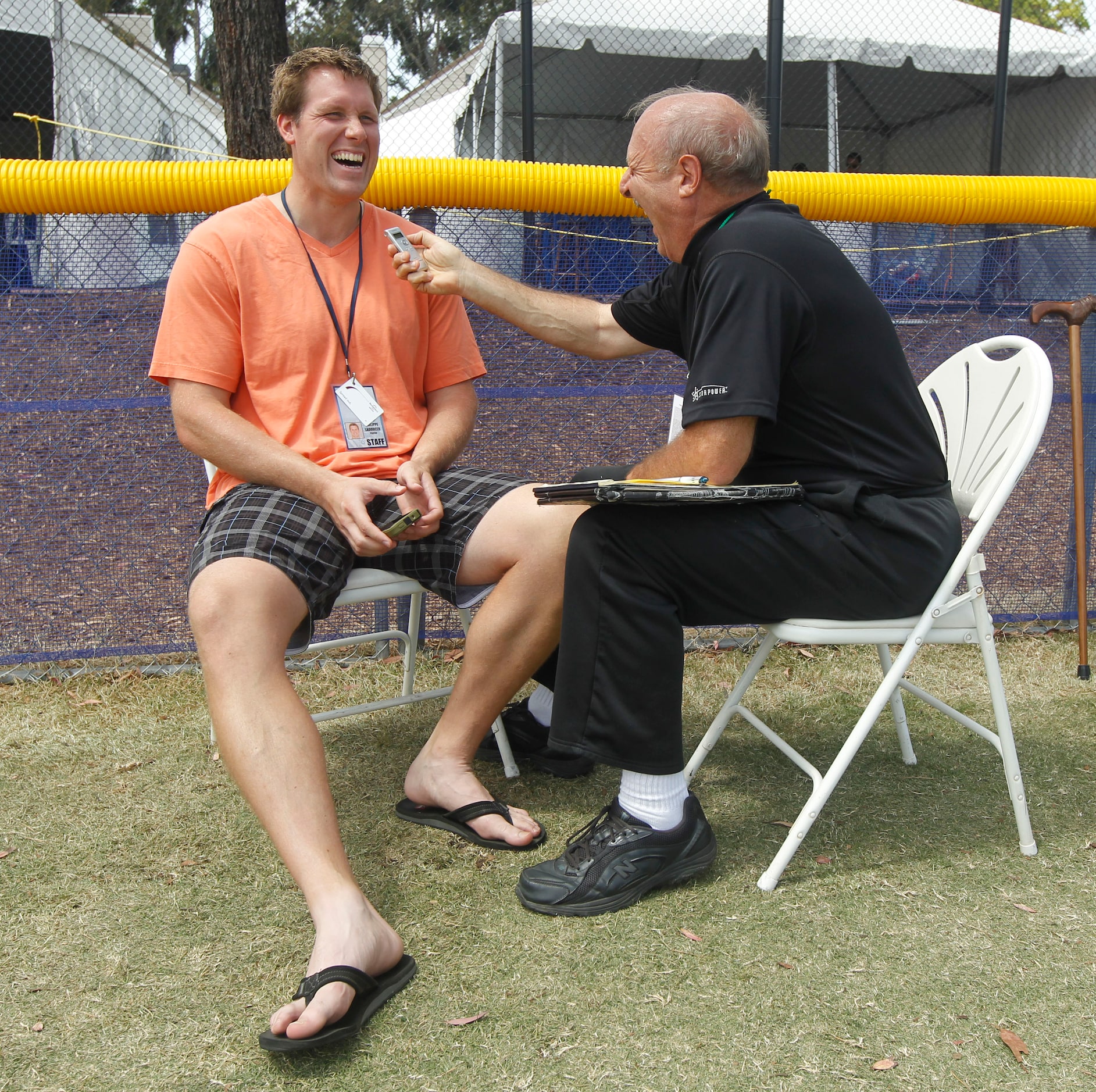 Dallas Cowboys long snapper L.P. LaDouceur (91) laughs as he is interviewed by Norm Hitzges...