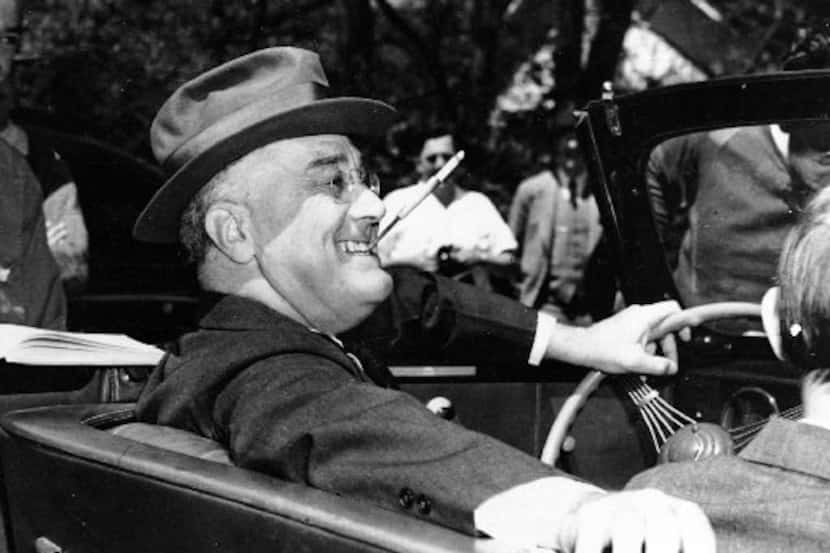 President Franklin Delano  Roosevelt sits at the steering wheel of his automobile at Warm ...