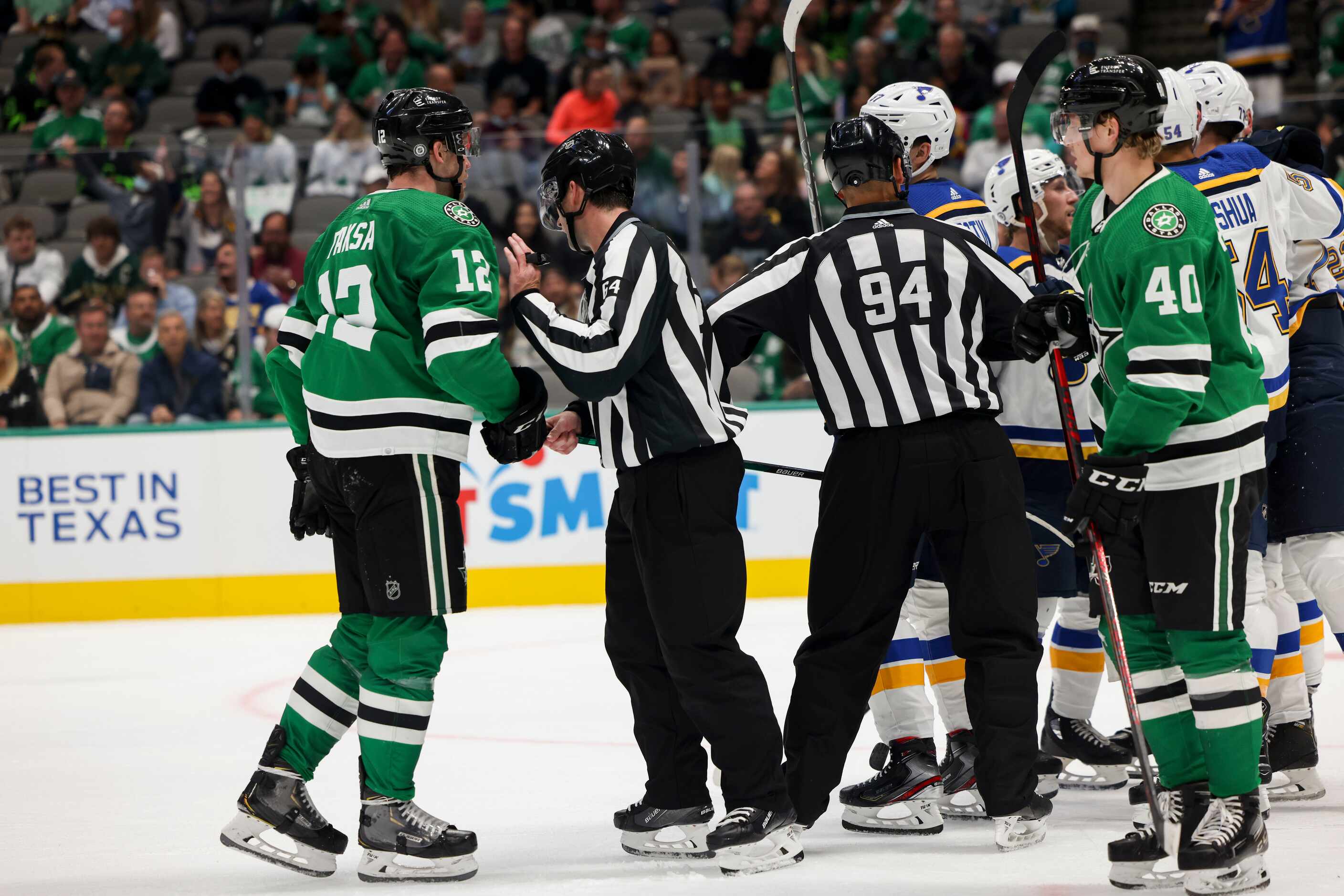 Referees separate players during the second period of a Dallas Stars preseason game against...