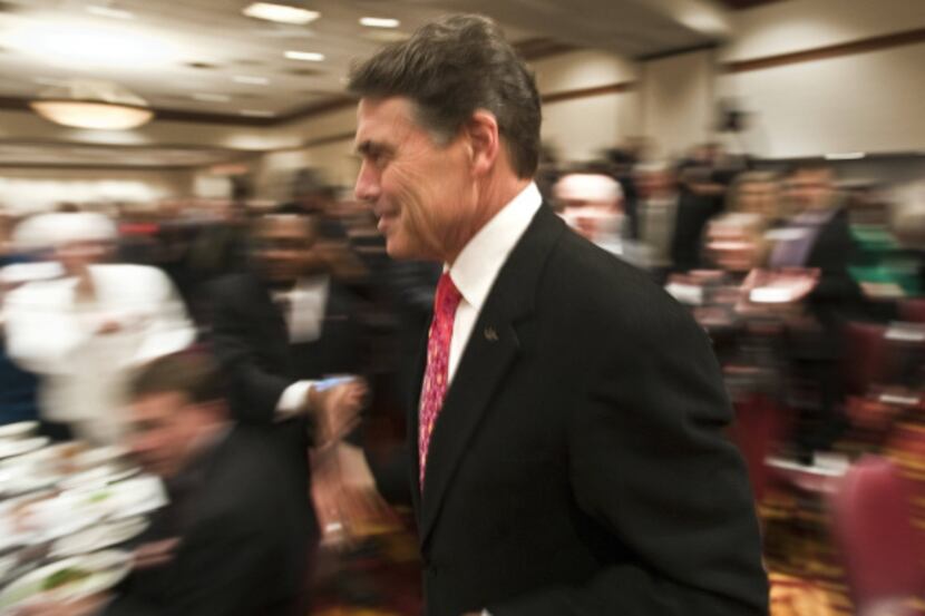 Texas Gov. Rick Perry made the rounds at the Williamson County Reagan Day dinner in Round...