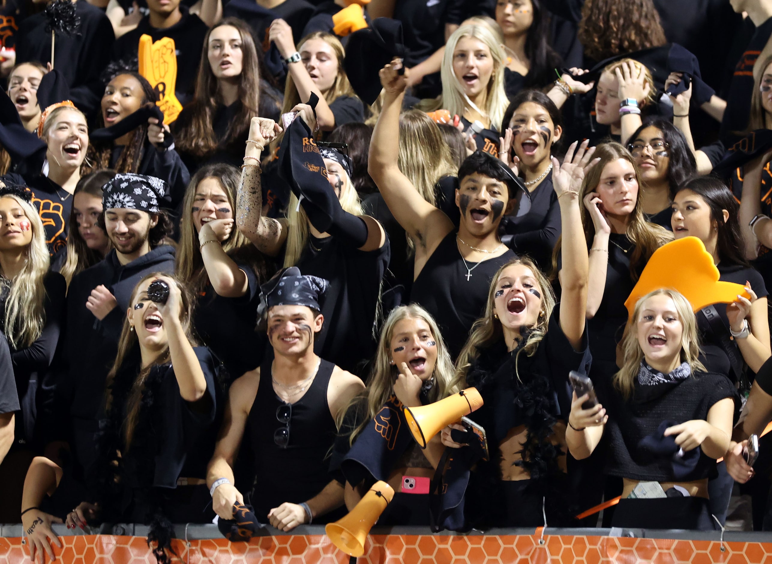 The Rockwall High student section cheers after a Yellowjackets’ first down during the first...