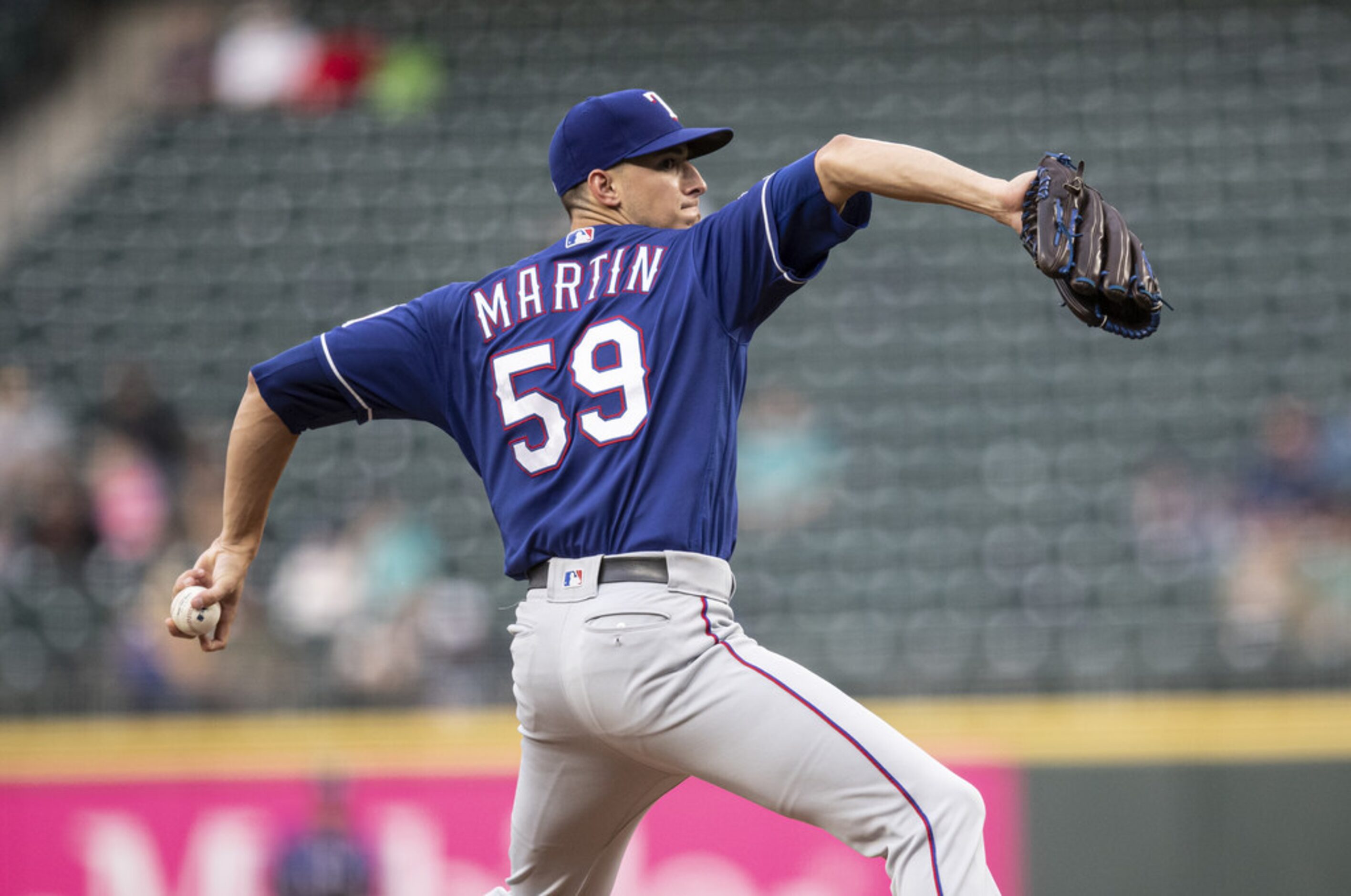 SEATTLE, WA - JULY 23: Starter Brett Martin #59 of the Texas Rangers delivers a pitch during...