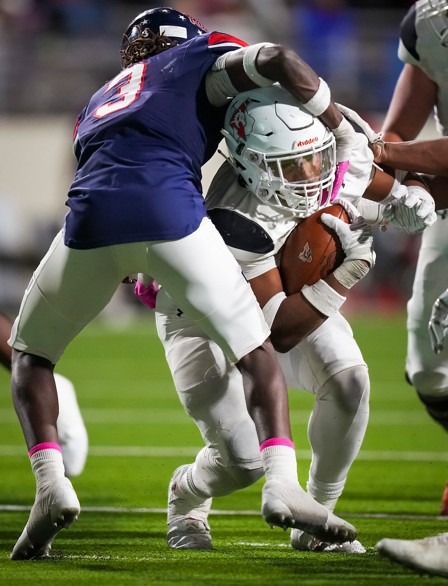 Aledo running back Davhon Keys is brought down by Denton Ryan defensive back Kaden Kelly (3)...