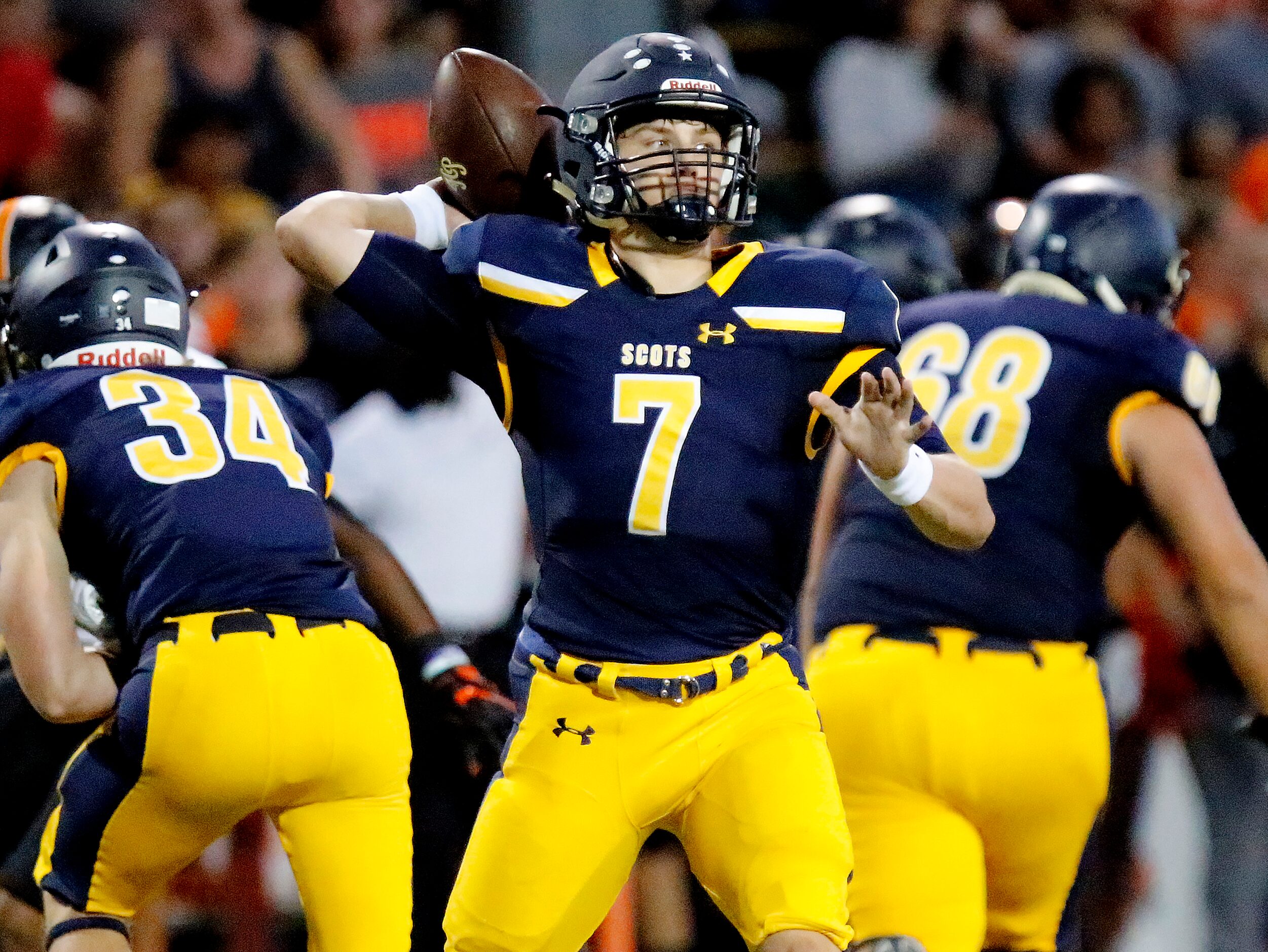 Highland Park High School quarterback Brennan Storer (7) throws a pass during the first half...