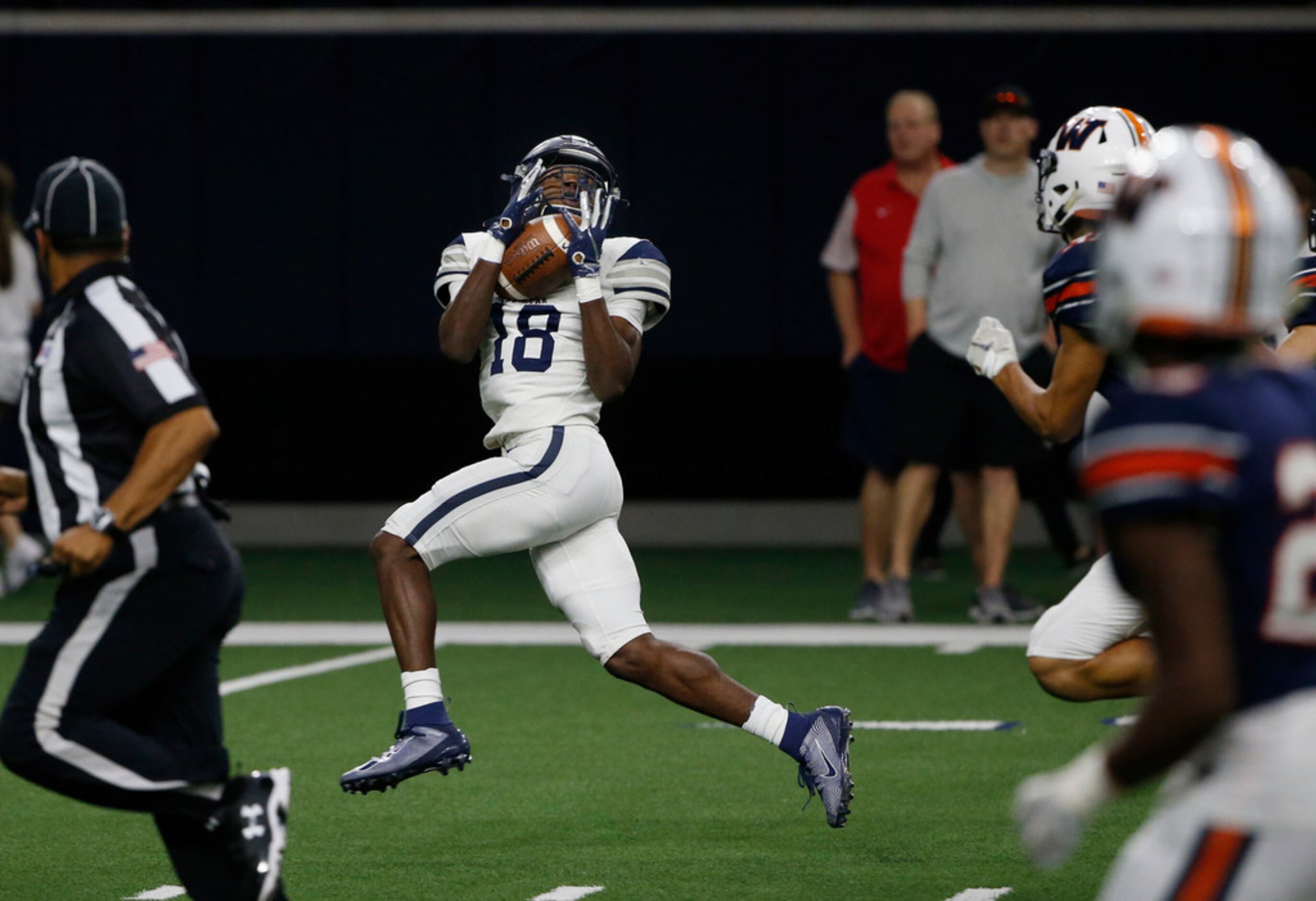 Frisco Lone Star receiver Marvin Mims (18) catches a pass on the first play of the game for...