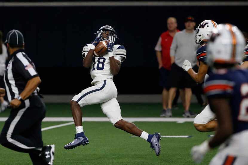 Frisco Lone Star receiver Marvin Mims (18) catches a pass on the first play of the game for...